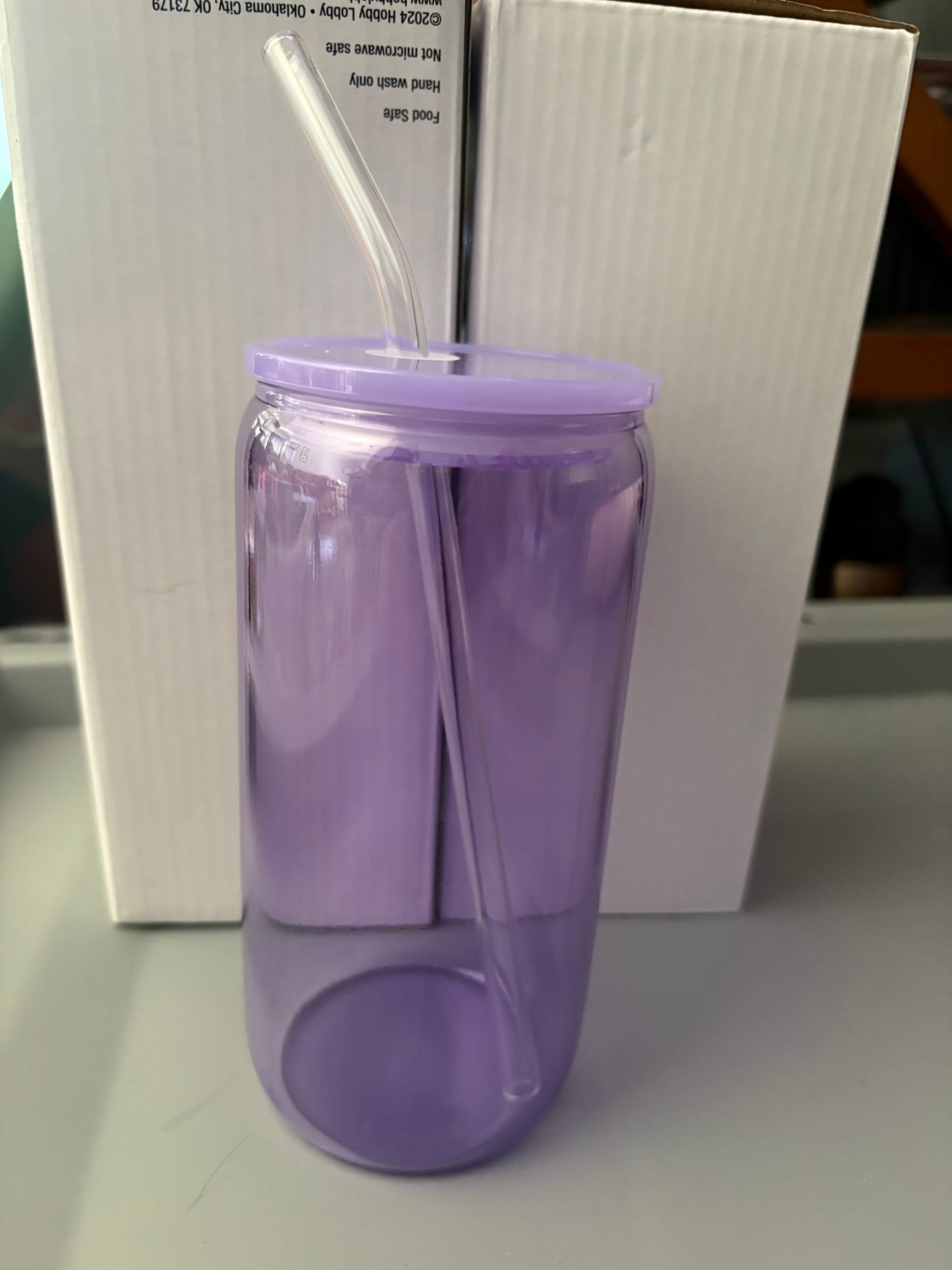 purple glass cup with lid and straw
