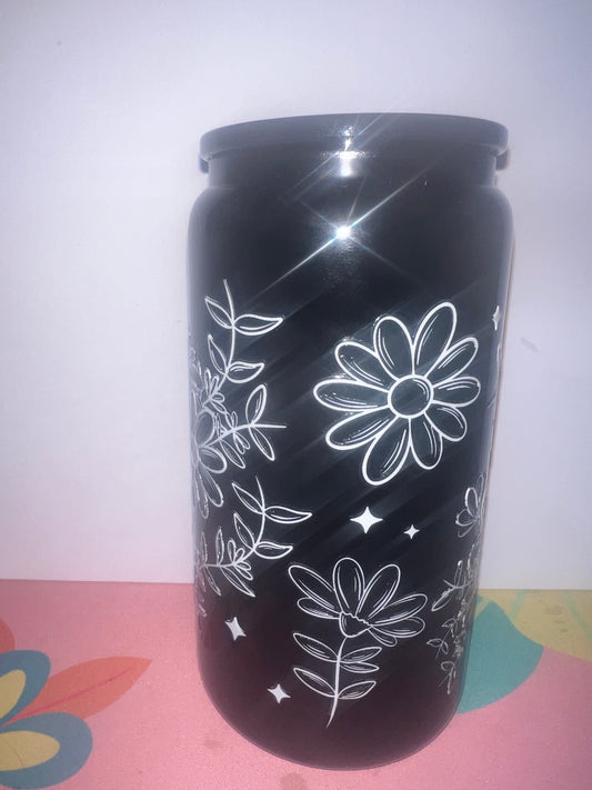 simple flowers on black glass can